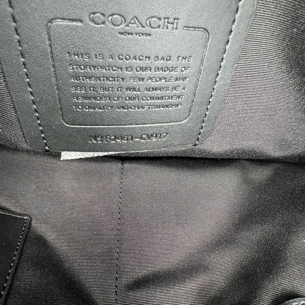 Coach Slim Brief In Signature Canvas With Trolley Sleeve